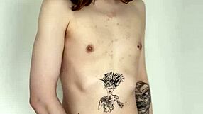 The tattooed transsexual slut jerks her cock in a solo masturbation session