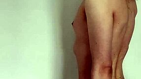 The tattooed transsexual slut jerks her cock in a solo masturbation session