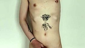 The tattooed transsexual slut jerks her cock in a solo masturbation session