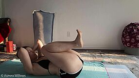 Detailed yoga lesson with clothed instructor demonstrating poses and movements on a mat