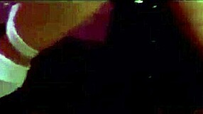 a woman quietly explores her body alone in her room