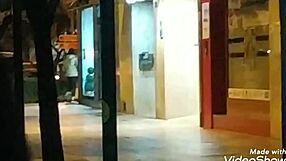 young woman gives handjob on public road outdoor