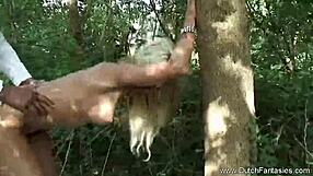 Dutch person leaning against a tree