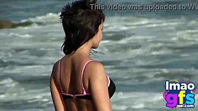 Hot brunette babe in lingerie masturbates pussy on beach, reaching orgasm with lesbian sucking