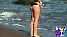 Hot brunette babe in lingerie masturbates pussy on beach, reaching orgasm with lesbian sucking