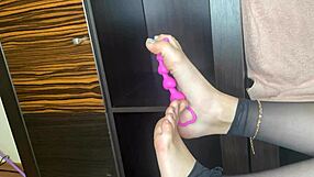 Closeup Foot in Black Stockings Teases Anal on Bed