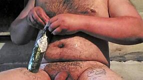 russian gay guy with painted lips uses a store cucumber