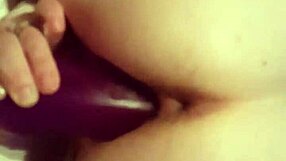 Wife stretches her pussy intensely with deep purple dildo fucking.