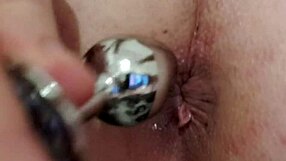 I carefully insert the butt plug for relaxation