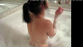 Tiny red slut teases with her perfect body in the bathtub