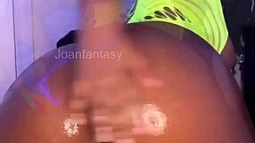 Joanfantasyxo's oiled body glistens as she toys her ass and pussy solo