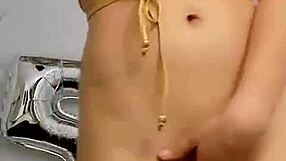 The young latina performs a sexy striptease, undressing and ripping her clothes