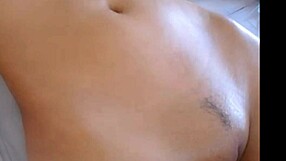 i watch this sexy asian girl rubbing lotion on her boobs and tits, it's so hot i wanna touch them!