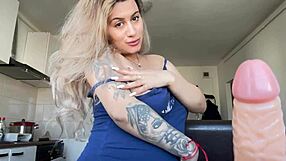 i see a blonde teasing with a toy in the kitchen