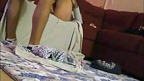 A horny wife explores double penetration with her husband using a dildo in their amateur session.