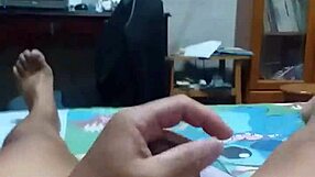 lying on bed, stroking cock with intense pleasure until spraying cum