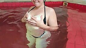 red POV video of a sexy hot amateur in a tiny two piece bikini flirting with the camera before intimacy by the pool - the entire video