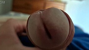 I capture a close-up of my dick's head in this homemade gay video.