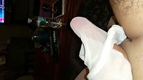 she teases with her white pantyhose feet, giving a sensual footjob to his toes