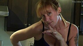 Cute redhead dances in kitchen