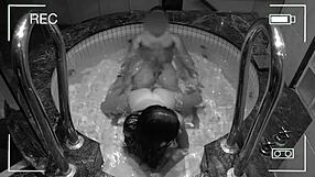 surveillance camera catches unfaithful wife in hotel jacuzzi.