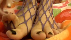 Teen In Fishnets Toys Her Pussy On Webcam