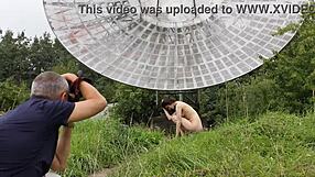 Brunette's Natural Tits Exposed in Public Nude Shoot Near Old Space Radar