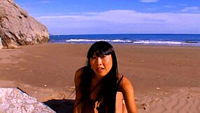 Hot Asian pornstar Sharon Lee undresses on the public beach, her perfect body exposed as clothes rip off