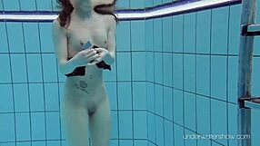 underwater babe roxalana cheh strips naked in steamy bath