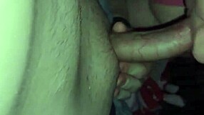 Two friends just hang around while one gets bent on the living room