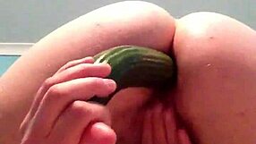 aussie blonde plays with cucumber