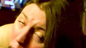 A big black cock is being sucked deeply and passionately by a big beautiful woman.