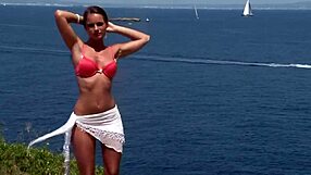 Chick In Bikini Performs Striptease By Cliff Outdoors