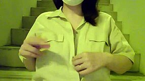 A Chubby Japanese MILF Masturbates Boldly On Apartment Stairs In Selfie