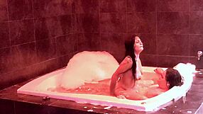 In the jacuzzi, her natural big tits bounce as she rides and moans