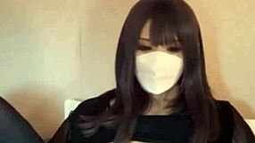 Beautiful Japanese ladyboy masturbates in hotel room during solo shoot