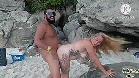 African beauty with tattoos gets it hard on daddy blonde on the beach