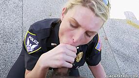 Police officers of color engage in oral sex with white officers on the street.
