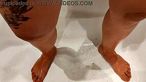 Emma's tight pussy gets a close-up shave in bath