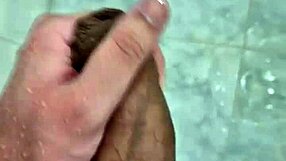 Well-endowed twink plays suggestively in the shower