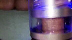 Asian ebony guy edges with toy on couch