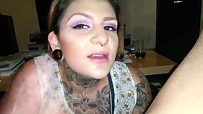 The tattooed woman delivers a bold and intense blowjob to her partner