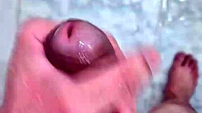 Well-endowed twink plays suggestively in the shower