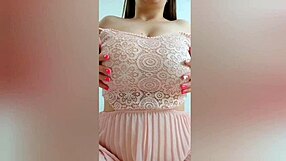 young cutie in pink dress fingering her big tits