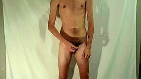 Petite boy's solo session with gay porn and cumming