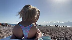 Public beach babe shows off her sexy body outdoors