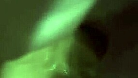 Close up of a woman pleasuring herself with a vibrator on her clit