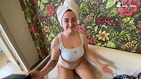 A horny woman with large breasts gives a blow job to a man with a big dick