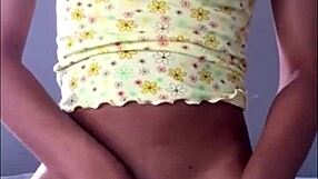 Tiny teen flaunts puffy pink pussy and panties on camera