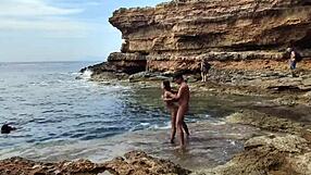 Divers watch us banging hard on the sunny beach.